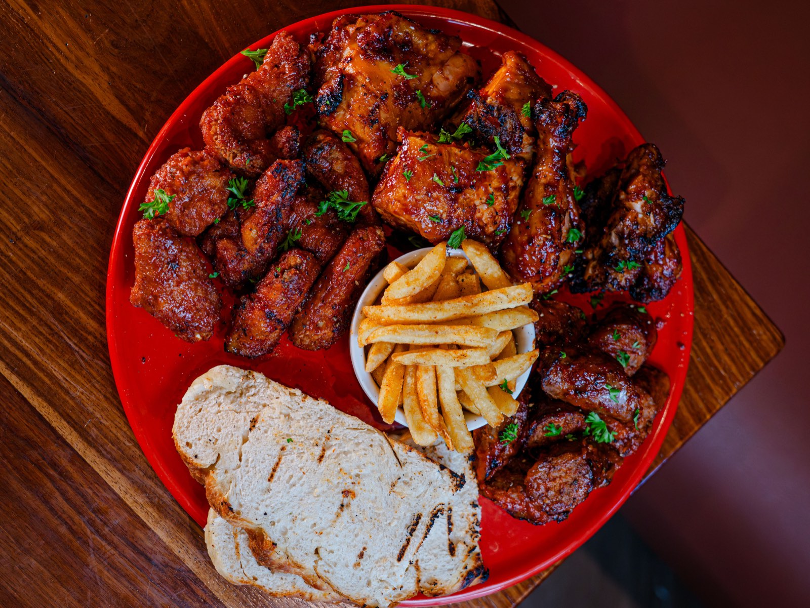 Sharing platter of wood-fired and flame-grilled dishes at Fire & Oak Social House, Florida Road, Durban